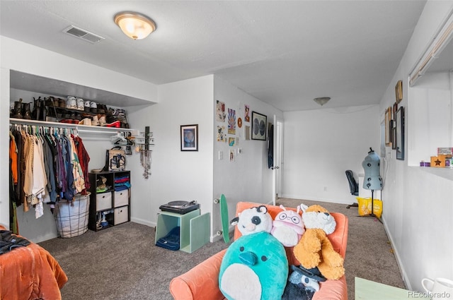 carpeted bedroom with a closet