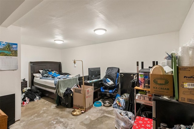 bedroom featuring concrete flooring