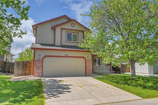 11963 Dahlia Dr, Thornton, CO 80233 - view of front of home featuring brick siding, a garage, and driveway