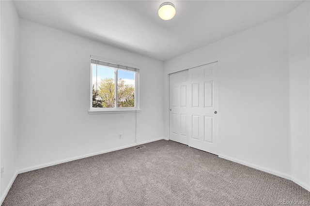 11963 Dahlia Dr, Thornton, CO 80233 - unfurnished bedroom with carpet, baseboards, and a closet