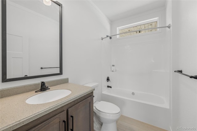 full bathroom featuring toilet, vanity, and bathing tub / shower combination