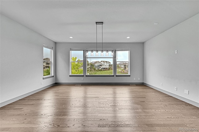 8179 S Kellerman Cir, Aurora, CO 80016 - unfurnished room featuring wood-type flooring, recessed lighting, and baseboards