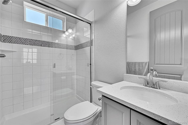8179 S Kellerman Cir, Aurora, CO 80016 - full bath with a textured wall, a shower stall, toilet, and vanity