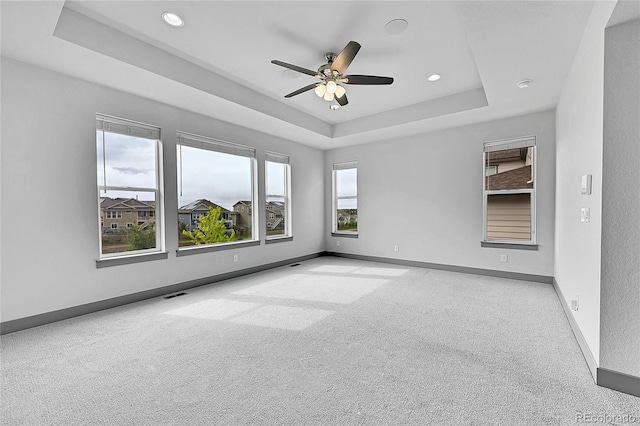8179 S Kellerman Cir, Aurora, CO 80016 - carpeted empty room featuring a raised ceiling, baseboards, a ceiling fan, and recessed lighting