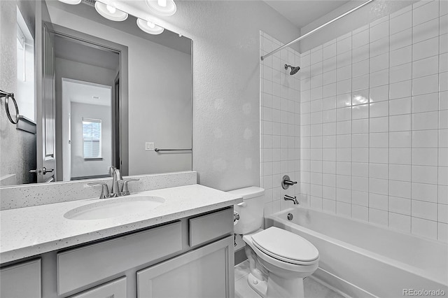 8179 S Kellerman Cir, Aurora, CO 80016 - bathroom with vanity, toilet, shower / tub combination, and a textured wall