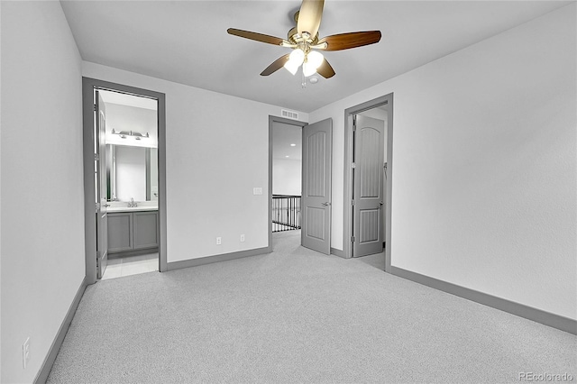 8179 S Kellerman Cir, Aurora, CO 80016 - unfurnished bedroom featuring baseboards, light carpet, ensuite bath, and ceiling fan