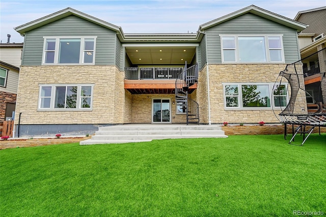 8179 S Kellerman Cir, Aurora, CO 80016 - rear view of property with stone siding, stairway, a lawn, and a patio