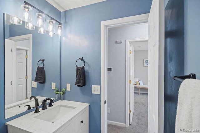 bathroom with vanity and baseboards