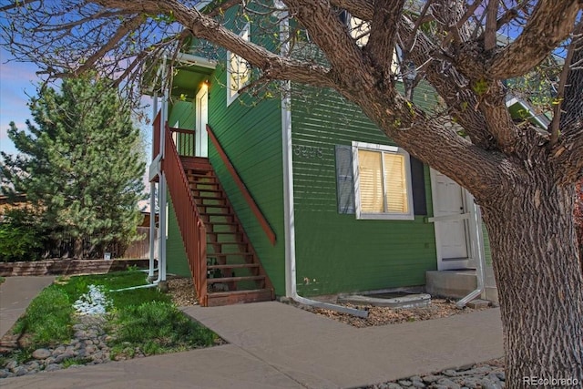 exterior space featuring entry steps and stairway