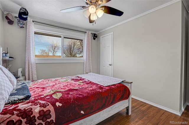 bedroom with dark hardwood / wood-style flooring, ceiling fan, and ornamental molding