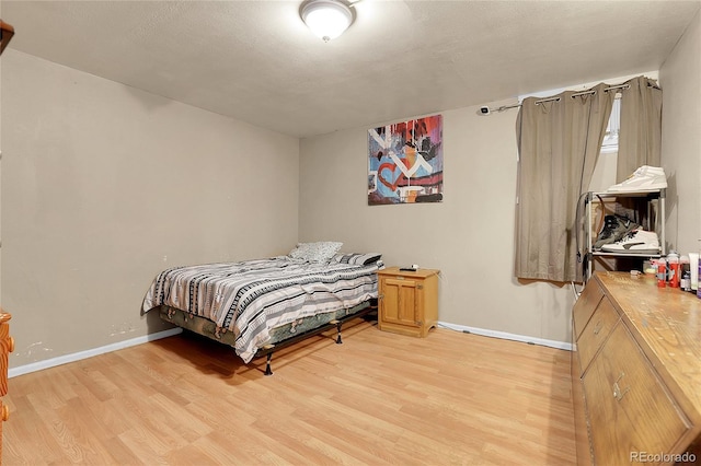 bedroom with light hardwood / wood-style flooring