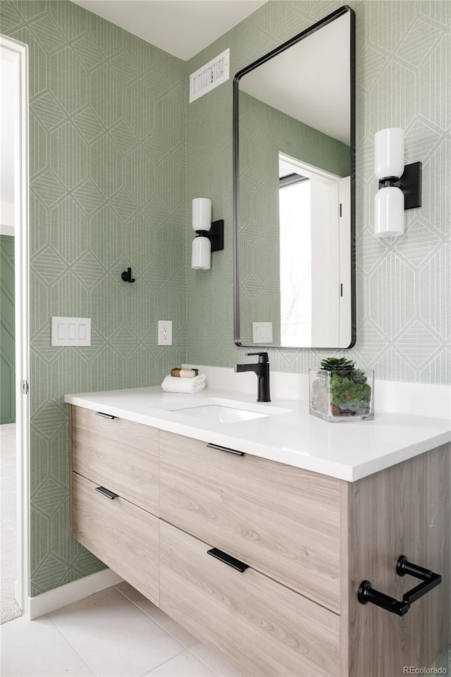 bathroom with tile patterned flooring and vanity