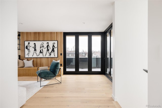 doorway featuring light hardwood / wood-style flooring and floor to ceiling windows