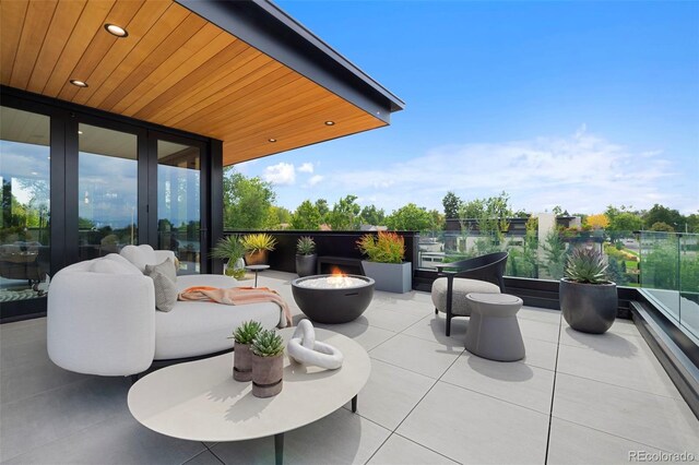 view of patio featuring a fire pit