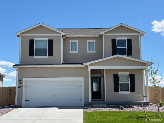 2204 Alyssa St, Fort Lupton, CO 80621 - view of front facade featuring an attached garage, covered porch, driveway, and a shingled roof