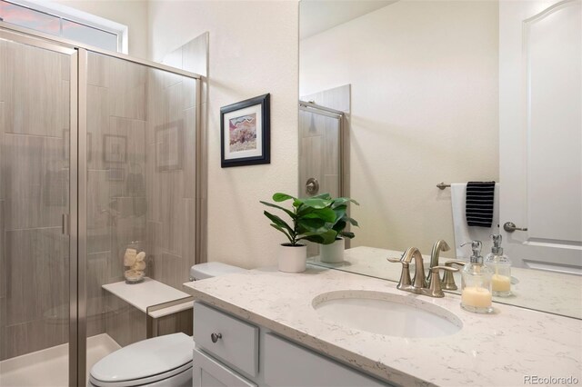 8751 S Wenatchee Ct, Aurora, CO 80016 - full bath with toilet, a shower stall, and vanity