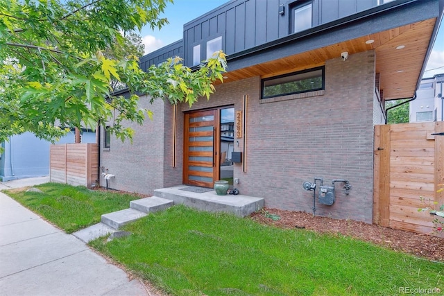 2280 W 42nd Ave, Denver, CO 80211 - property entrance featuring board and batten siding and brick siding