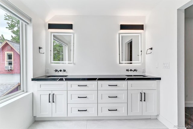 2280 W 42nd Ave, Denver, CO 80211 - full bath with double vanity, healthy amount of natural light, cooling unit, and baseboards