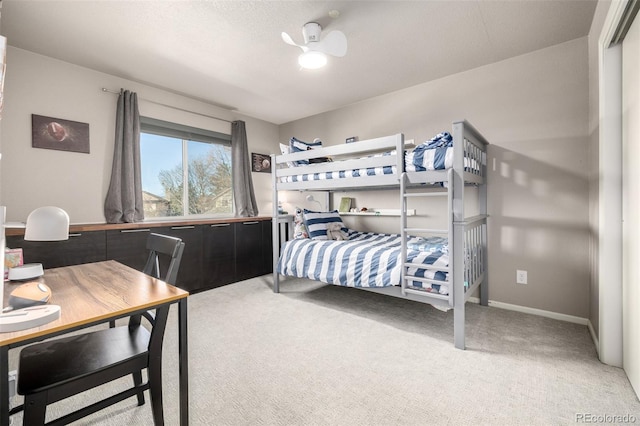 bedroom featuring baseboards and carpet flooring