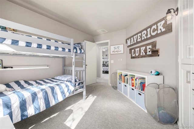 carpeted bedroom with visible vents