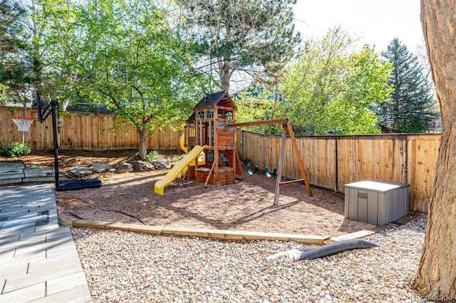 view of playground with a fenced backyard