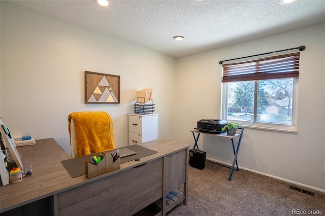 carpeted office space with baseboards, a textured ceiling, visible vents, and recessed lighting