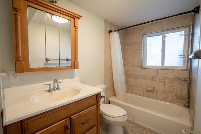 bathroom featuring shower / bath combo with shower curtain, tile patterned floors, vanity, and toilet