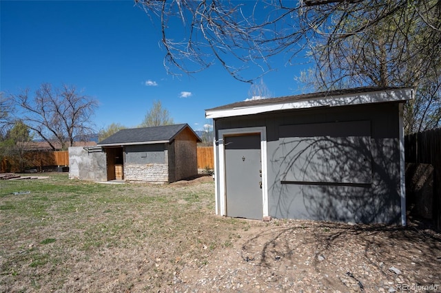 view of shed with fence