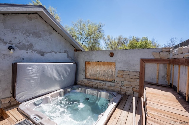 exterior space with a hot tub
