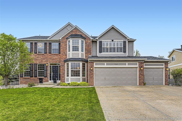 view of front of property featuring concrete driveway, a front lawn, and brick siding