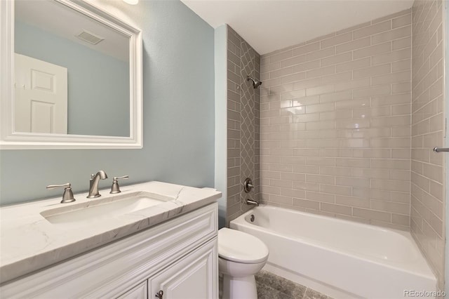 bathroom with toilet, tub / shower combination, and vanity