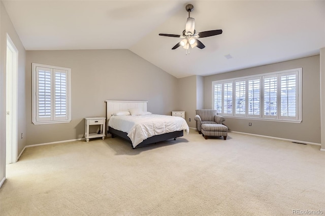 bedroom featuring carpet, lofted ceiling, baseboards, and ceiling fan