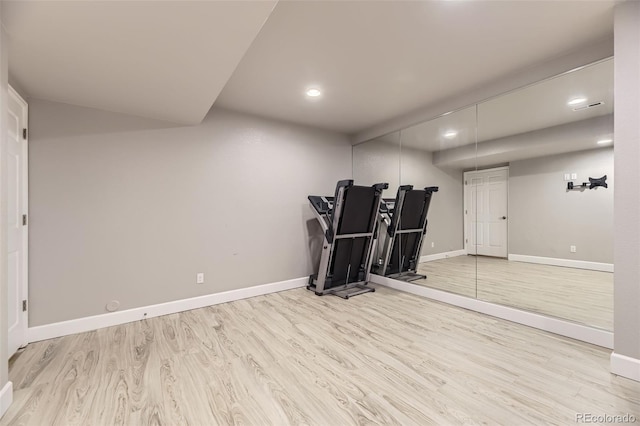 workout area with wood finished floors, baseboards, and recessed lighting