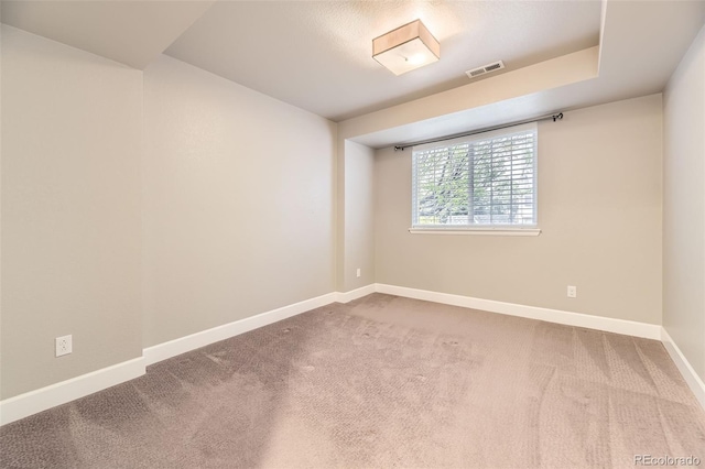 unfurnished room with baseboards and carpet floors