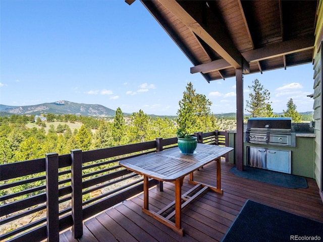 3395 Timbergate Trl, Evergreen, CO 80439 - deck featuring an outdoor kitchen and a mountain view