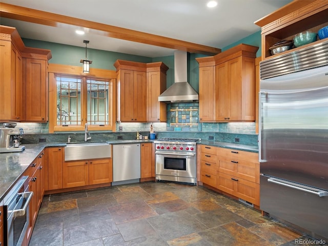 3395 Timbergate Trl, Evergreen, CO 80439 - kitchen featuring premium appliances, wall chimney exhaust hood, decorative backsplash, stone tile flooring, and recessed lighting