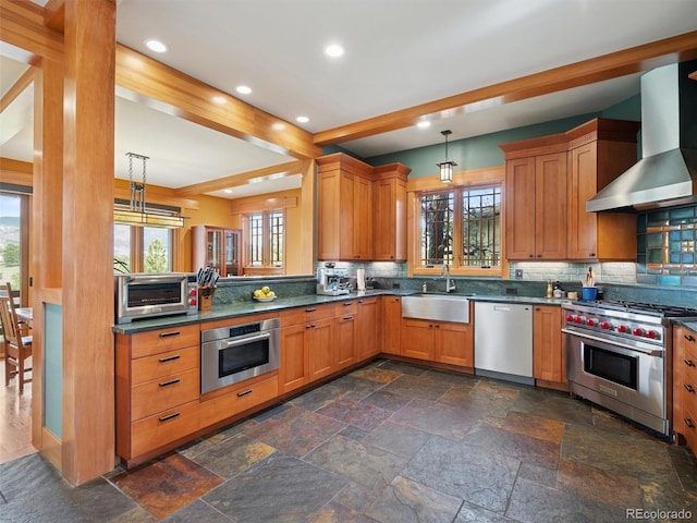 3395 Timbergate Trl, Evergreen, CO 80439 - kitchen with appliances with stainless steel finishes, wall chimney range hood, backsplash, hanging light fixtures, and recessed lighting