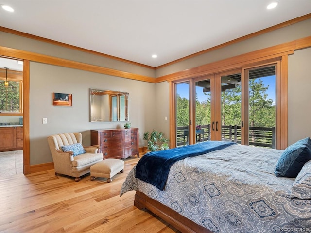 3395 Timbergate Trl, Evergreen, CO 80439 - bedroom featuring access to outside, recessed lighting, wood finished floors, crown molding, and french doors