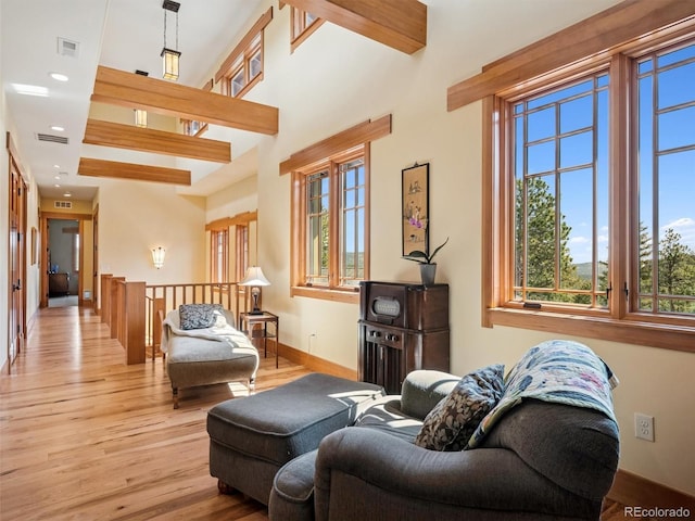 3395 Timbergate Trl, Evergreen, CO 80439 - living room featuring plenty of natural light, wood finished floors, and recessed lighting