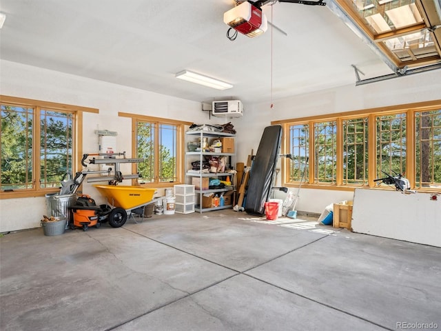 3395 Timbergate Trl, Evergreen, CO 80439 - garage featuring a garage door opener and a wall unit AC