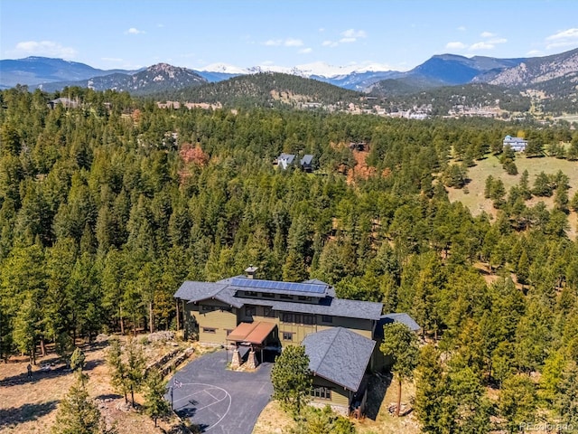 3395 Timbergate Trl, Evergreen, CO 80439 - view of subject property with a heavily wooded area and mountains