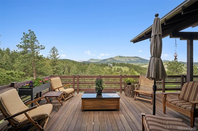 3395 Timbergate Trl, Evergreen, CO 80439 - wooden deck with a mountain view and a wooded view
