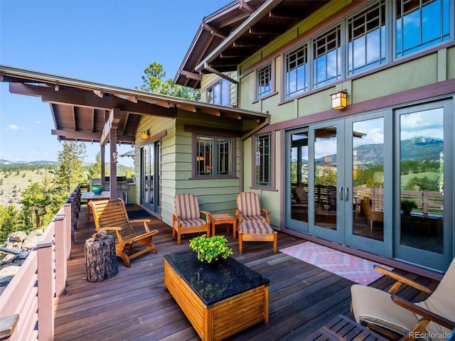 3395 Timbergate Trl, Evergreen, CO 80439 - deck with french doors, area for grilling, and a mountain view