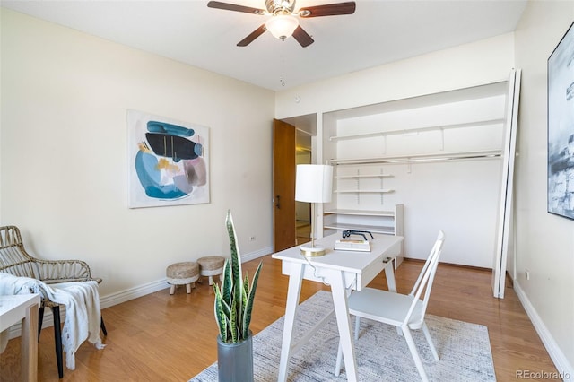 office space with ceiling fan and light hardwood / wood-style floors