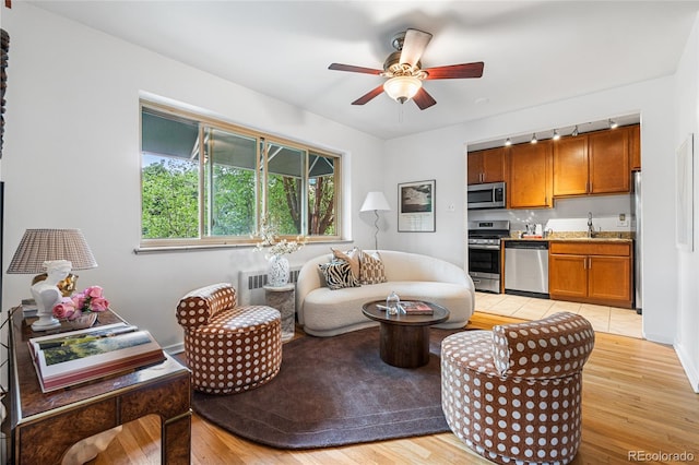 2100 N Franklin St Unit 5, Denver, CO 80205 - living area with light wood-type flooring and a ceiling fan