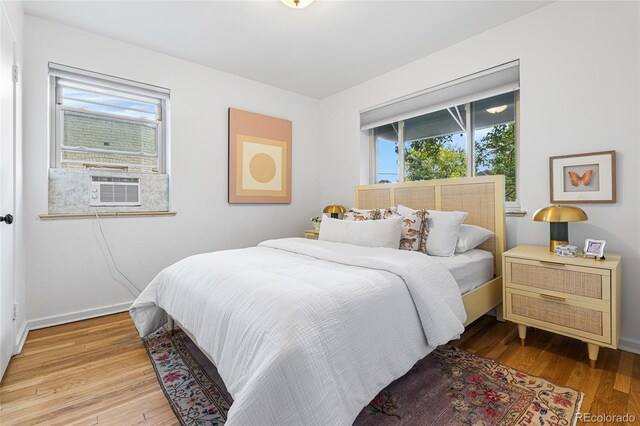 2100 N Franklin St Unit 5, Denver, CO 80205 - bedroom with cooling unit and light wood-style flooring