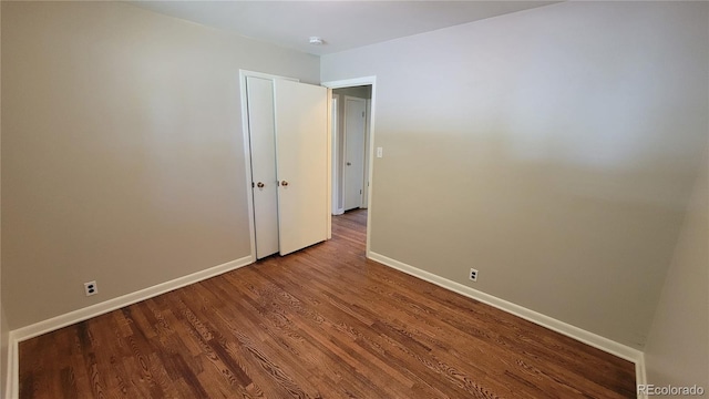 unfurnished room featuring hardwood / wood-style flooring