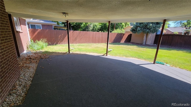 view of patio featuring a storage shed