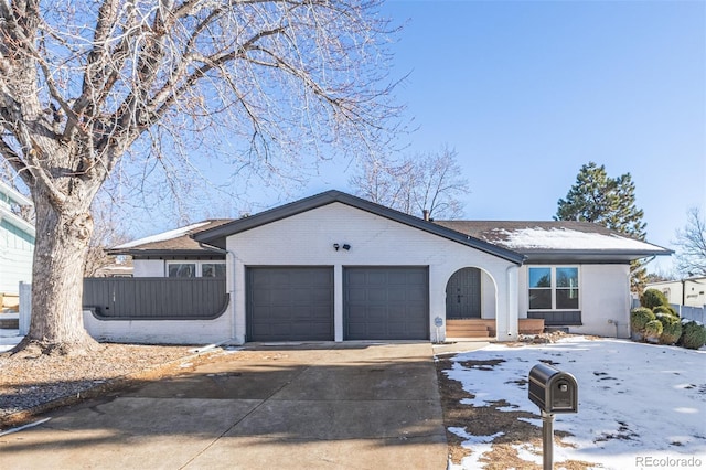 ranch-style house featuring a garage