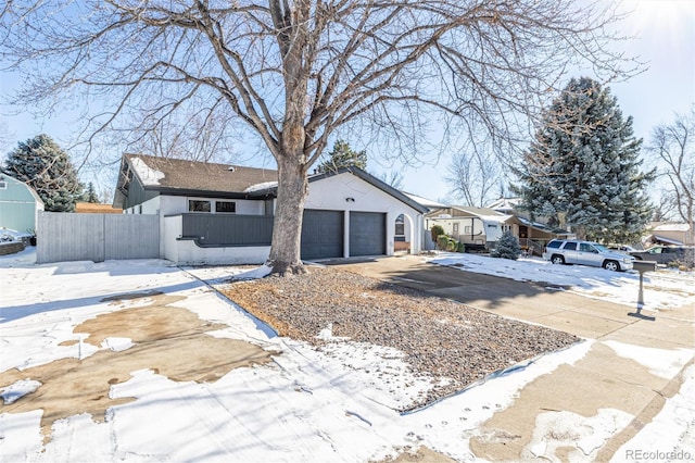 single story home featuring a garage